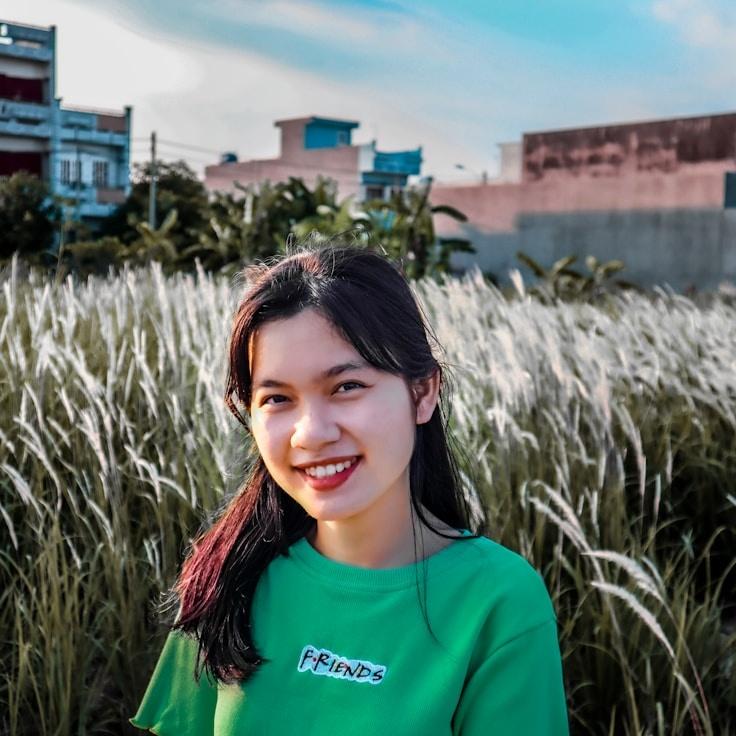 Kaveri Mehta, Lead Design Curator at QuillMeadowHarbor, reviewing corporate floral arrangements